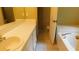 A bathroom featuring a sink with cabinets and a bathtub with tile at 330 Christian Woods Dr, Conyers, GA 30013