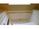 A bathtub with tile surround, faucet, and spout at 330 Christian Woods Dr, Conyers, GA 30013