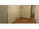 A laundry room with a door, shelves, and vinyl flooring at 330 Christian Woods Dr, Conyers, GA 30013