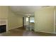 Open-concept living room with fireplace, vaulted ceilings, and seamless transition to the breakfast bar at 330 Christian Woods Dr, Conyers, GA 30013