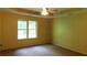 A main bedroom featuring a ceiling fan and large window at 330 Christian Woods Dr, Conyers, GA 30013