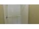 Standard white shower with chrome knob and built in shelves on the back wall at 330 Christian Woods Dr, Conyers, GA 30013