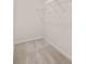 Empty walk-in closet with carpet and metal shelving offers an abundance of storage space at 1404 Gray Branch Dr, Lawrenceville, GA 30045
