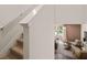 View of the carpeted staircase leading to the living room featuring modern decor and a neutral color scheme at 1404 Gray Branch Dr, Lawrenceville, GA 30045