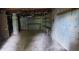 Unfinished basement with concrete block walls, exposed ceiling, and concrete floor at 2980 Wanda Sw Cir, Atlanta, GA 30315
