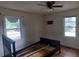 Bedroom featuring hardwood floors, a ceiling fan, and windows offering natural light at 2980 Wanda Sw Cir, Atlanta, GA 30315