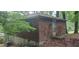 Back exterior of home with brick exterior and partial view of landscaping at 2980 Wanda Sw Cir, Atlanta, GA 30315