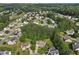 Aerial view showcases a neighborhood with lush greenery, mature trees, and well-maintained homes at 405 Mount Vernon Ct, Woodstock, GA 30189