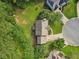 Overhead view showing the home's roof, landscaping, and proximity to mature trees, offering privacy and shade at 405 Mount Vernon Ct, Woodstock, GA 30189