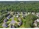 Aerial view of the neighborhood surrounded by lush greenery and mature trees at 405 Mount Vernon Ct, Woodstock, GA 30189