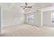 Spacious bedroom featuring neutral carpeting, light colored walls, and vaulted ceiling at 405 Mount Vernon Ct, Woodstock, GA 30189