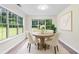 Breakfast nook features natural light from surrounding windows and neutral tones at 405 Mount Vernon Ct, Woodstock, GA 30189