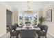 Elegant dining room with bay window, chandelier, and ample space for entertaining at 405 Mount Vernon Ct, Woodstock, GA 30189