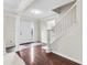 Inviting foyer with hardwood floors, staircase, and elegant architectural columns at 405 Mount Vernon Ct, Woodstock, GA 30189