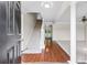 Inviting foyer with hardwood floors, staircase, and elegant architectural columns at 405 Mount Vernon Ct, Woodstock, GA 30189