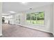 Living area has ample natural light and view into kitchen at 405 Mount Vernon Ct, Woodstock, GA 30189