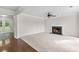 Spacious living room with fireplace, crown molding, and neutral decor at 405 Mount Vernon Ct, Woodstock, GA 30189