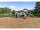 Community playground with slides, ladders, and wood chip ground cover at 405 Mount Vernon Ct, Woodstock, GA 30189