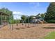 Community playground with slides, swings, and a covered structure at 405 Mount Vernon Ct, Woodstock, GA 30189