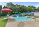 Community pool featuring a slide, lifeguard, and lush landscaping, offering a fun and safe swimming experience at 405 Mount Vernon Ct, Woodstock, GA 30189