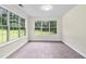 Sunroom features large windows allowing natural light to pour into the space at 405 Mount Vernon Ct, Woodstock, GA 30189