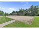 Outdoor sand volleyball court with net and surrounding green grass at 405 Mount Vernon Ct, Woodstock, GA 30189