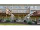 Townhome back exterior showing decks, patios, yard, and landscaping at 6043 China Rose Lane, Johns Creek, GA 30097