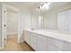 Long vanity with tons of storage in this bathroom; includes tile floor and walk-in shower at 6043 China Rose Lane, Johns Creek, GA 30097