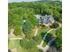 Aerial view of community clubhouse with pool surrounded by trees at 1063 Winding Branch Dr, Canton, GA 30114