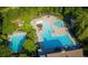 Gorgeous aerial shot of the community pool, splashpad and slide surrounded by lush landscaping at 1063 Winding Branch Dr, Canton, GA 30114