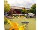 Relaxing outdoor area featuring Adirondack chairs and a brewery backdrop at 1063 Winding Branch Dr, Canton, GA 30114