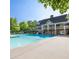 Large community pool with clubhouse in the background at 1063 Winding Branch Dr, Canton, GA 30114
