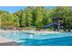 Enjoy the community pool, complete with a slide, lifeguard stand, and plenty of seating to relax by the pool at 1063 Winding Branch Dr, Canton, GA 30114