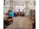 Cozy reading room with bookshelves, leather chairs, and wood floors at 1063 Winding Branch Dr, Canton, GA 30114