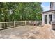 Spacious wooden back deck with table and chairs, offering an ideal outdoor dining area at 113 Stargaze Rdg, Canton, GA 30114