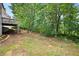 Expansive backyard with mature trees and landscaping at 113 Stargaze Rdg, Canton, GA 30114