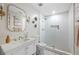 Well-lit bathroom with a glass enclosed shower, white subway tile, and a single sink vanity at 113 Stargaze Rdg, Canton, GA 30114