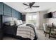 Comfortable bedroom with a dark wood accent wall, ceiling fan, and a cozy atmosphere at 113 Stargaze Rdg, Canton, GA 30114