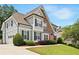 Charming two-story home with a manicured lawn, tasteful landscaping, and a welcoming exterior at 113 Stargaze Rdg, Canton, GA 30114