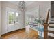 Welcoming foyer with hardwood floors, a staircase, and an open view to the dining area at 113 Stargaze Rdg, Canton, GA 30114
