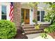 Elegant front door entrance with a brick facade, sidelights, and a well-maintained landscape at 113 Stargaze Rdg, Canton, GA 30114