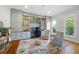 Bright home office featuring custom built-ins, hardwood floors, and a cozy seating area at 113 Stargaze Rdg, Canton, GA 30114