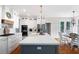 Spacious kitchen with a large island, quartz countertops, and stainless steel appliances at 113 Stargaze Rdg, Canton, GA 30114