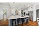 Stylish kitchen with a gray island, stainless steel appliances, and bar stool seating for casual dining at 113 Stargaze Rdg, Canton, GA 30114