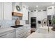 Elegant kitchen featuring white cabinets, brass hardware, and an expansive countertop with modern appliances at 113 Stargaze Rdg, Canton, GA 30114