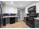Modern kitchen with stainless steel appliances and dark backsplash at 113 Stargaze Rdg, Canton, GA 30114