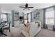 Inviting living room with a sofa, windows, carpet, and built-in shelving at 113 Stargaze Rdg, Canton, GA 30114