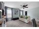Inviting living room with a sofa, windows, carpet, and television at 113 Stargaze Rdg, Canton, GA 30114