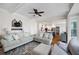 Open-concept living room with stylish decor and seamless flow to the adjacent kitchen at 113 Stargaze Rdg, Canton, GA 30114