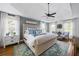 Inviting main bedroom boasts a tray ceiling, plush bedding, and soft, natural lighting at 113 Stargaze Rdg, Canton, GA 30114